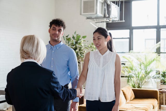 a-property-manager-conducting-a-property-showing-with-two-tenants