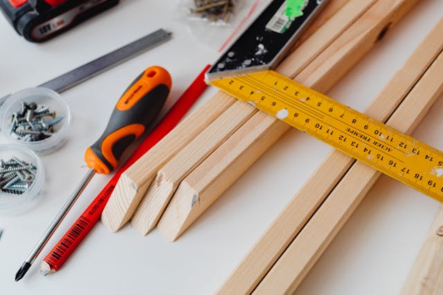 close-up-of-woodworking-tools-and-materials-on-white-surface