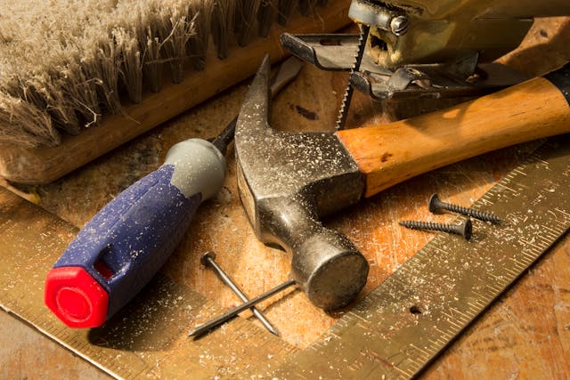 close-up-of-woodworking-tools-on-dusty-workbench
