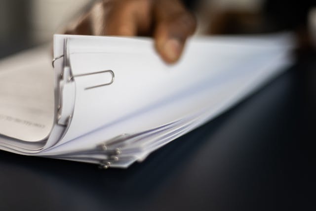 hand-flipping-through-paperwork