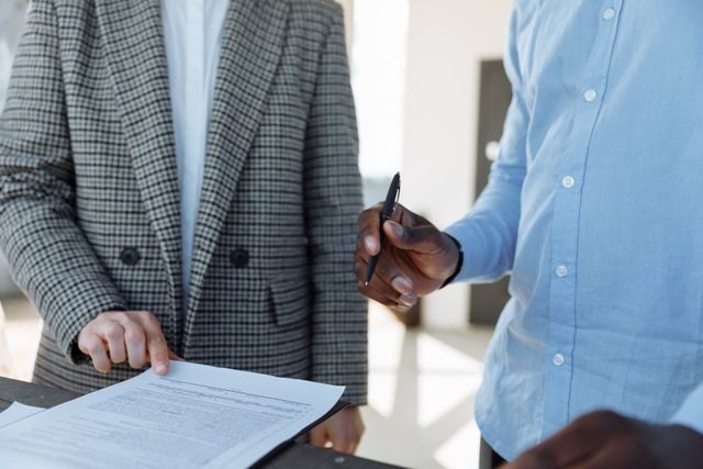 two people looking at a document