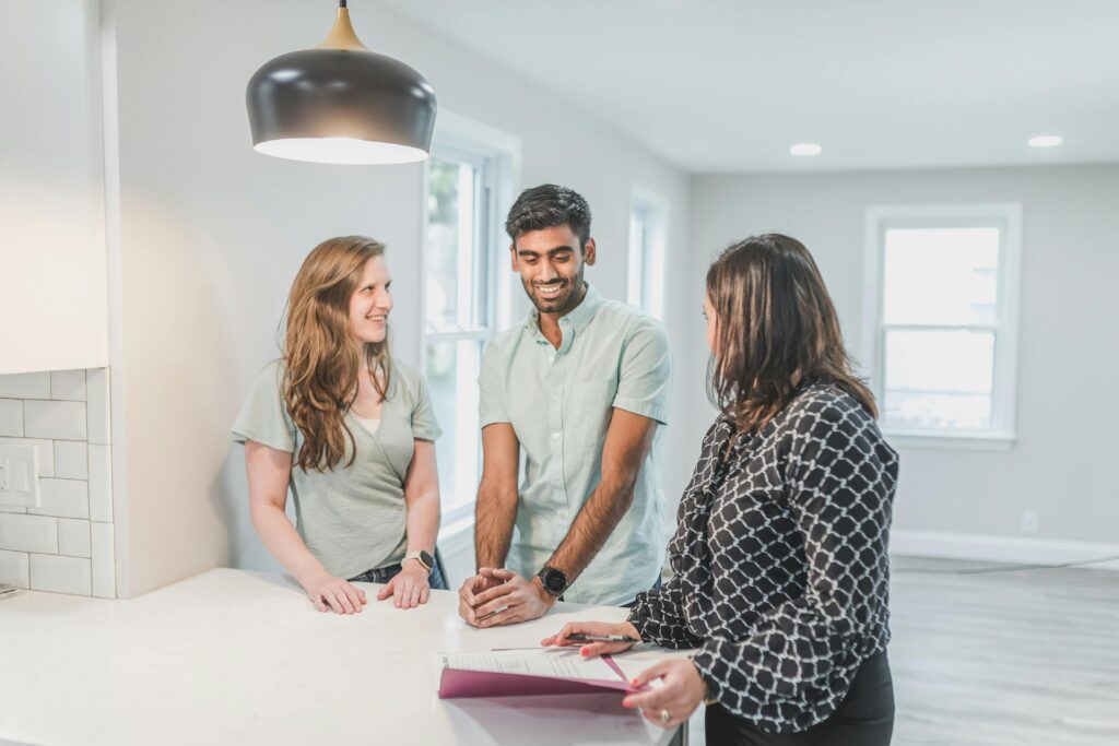 three-people-talking-in-an-empty-home